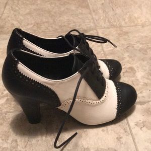 Black and white Oxford heels